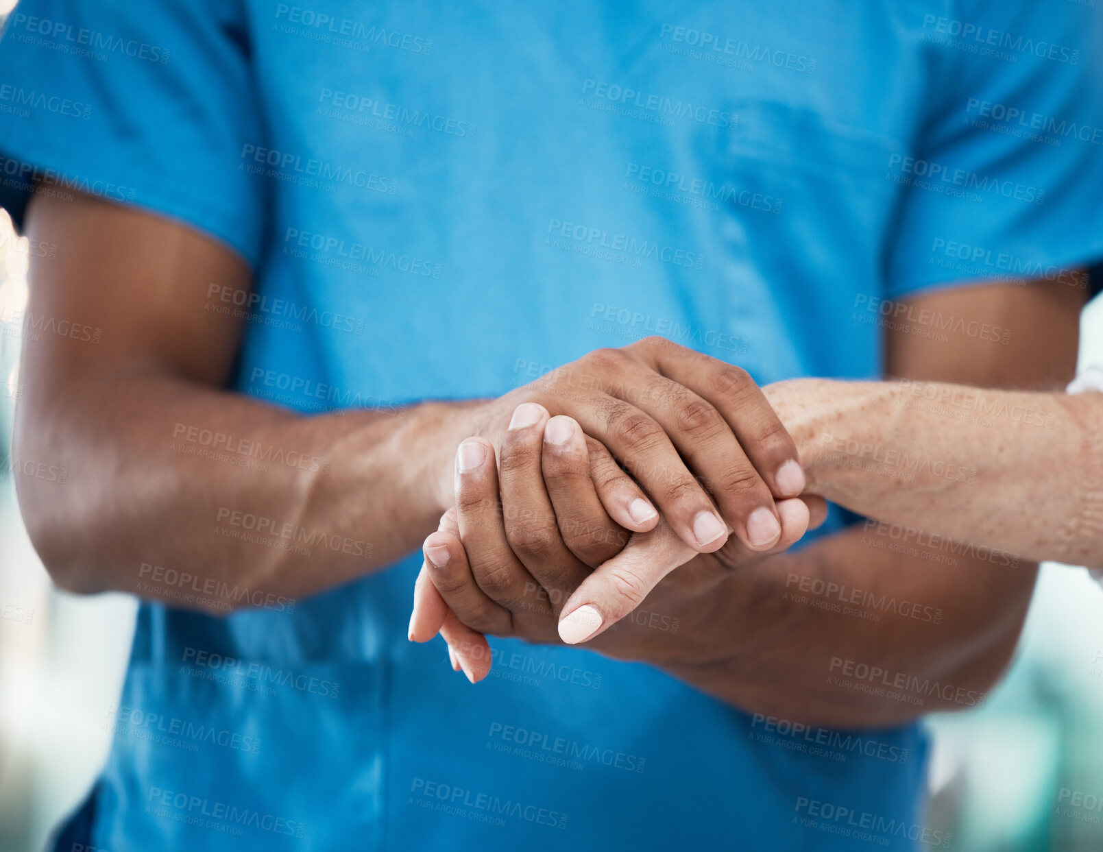 Buy stock photo Hands, support and nurse helping patient in hospital, care and empathy for people. Healthcare, assistance and black man or doctor holding hands of senior person for comfort after cancer diagnosis.