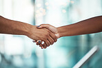 Hands, professional handshake and people in an office for greeting, welcome or agreement. Closeup of a hand of man and woman shaking hands in the workplace for partnership, deal or thank you gesture.