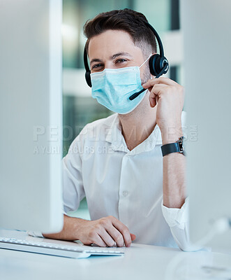 Buy stock photo Call center, face mask and covid office with telemarketing, CRM and customer support man at desk. Portrait of contact us agent, sales and customer service male consultant at computer during covid 19 