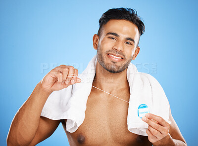Buy stock photo Dental care, floss and man cleaning teeth for oral hygiene routine, self care flossing or tooth healthcare. Mouth plaque treatment, aesthetic smile and beauty portrait of model with dental product