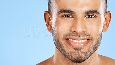 Buy stock photo Skincare, portrait and man in studio for beauty, teeth and wellness against a blue background mockup. Face, cleaning and skin by model happy, smile and relax during grooming, hygiene and body care