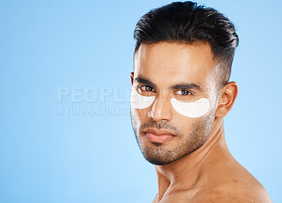 Buy stock photo Skincare, eyes patch and man portrait of beauty product, body cosmetics and wellness, facial treatment and aesthetic health on studio blue background. Arab guy face portrait, hydration and self care 