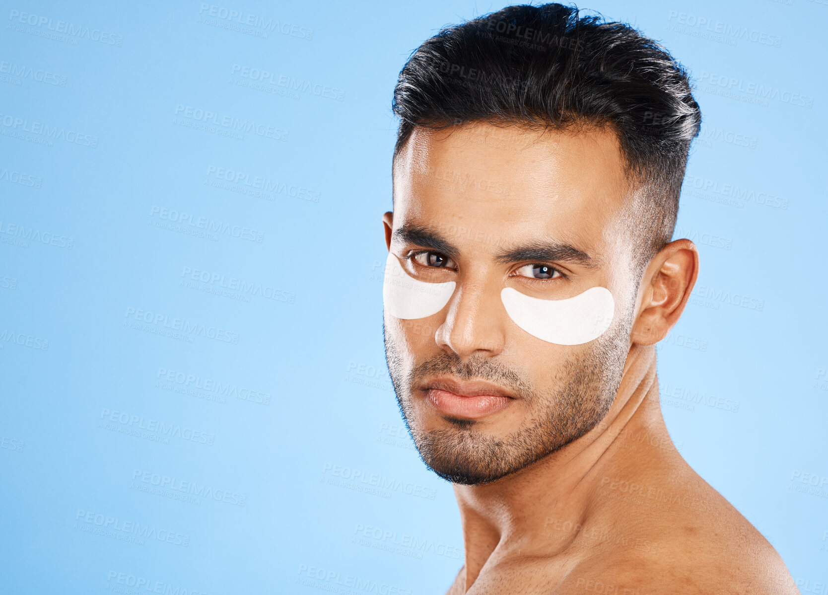 Buy stock photo Skincare, eyes patch and man portrait of beauty product, body cosmetics and wellness, facial treatment and aesthetic health on studio blue background. Arab guy face portrait, hydration and self care 
