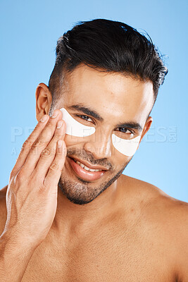 Buy stock photo Man, eye care and cotton patch for skincare, organic facial or wellness for health, body care or clear skin. Portrait, Indian male or natural beauty for anti wrinkle, remove dark circles or face glow