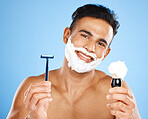 Man, razor and cream for skincare grooming, shaving or facial treatment against a blue studio background. Portrait of happy and satisfied male holding equipment for shave, beauty or clean hygiene