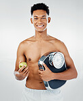 Apple, man and scale for health, fitness and diet in studio against white background mockup for weight loss. Fruit, training and wellness model with black man happy, smile and relax with nutrition