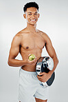 Man, apple and scale in studio for health, weight loss and vegan diet against white background mockup. Portrait, fruit and model with weight scale, nutrition and detox with happy, smile and relax guy