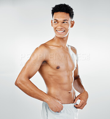 Buy stock photo Skincare, cleaning and man in towel after shower in studio for wellness, beauty and grooming against white background. Skin, bodycare and bathroom hygiene with guy model confident, muscular and happy