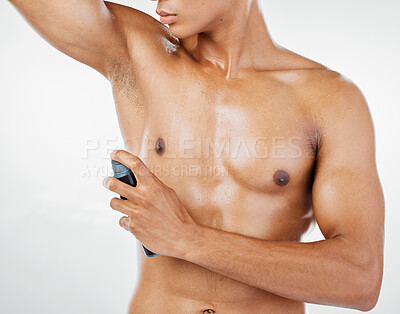 Buy stock photo Man with perfume or spray, body grooming and bare abdomen, clean and fresh with studio background. Cosmetic, hygiene product and cleaning, shirtless with deodorant, wellness and body care mockup.