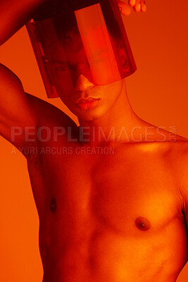 Buy stock photo Cyberpunk, glasses and red neon model with future style, fantasy lighting and futuristic sci fi mask for interactive fashion. Aesthetic, beauty and portrait of serious black man with creative light