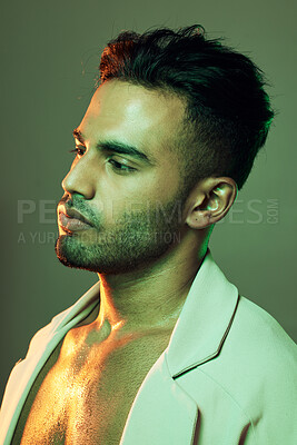 Buy stock photo Fashion, green lighting and beauty of male model in neon studio for cosmetics, designer clothes and art for aesthetic background. Man from India posing for skincare, motivation and cool attitude