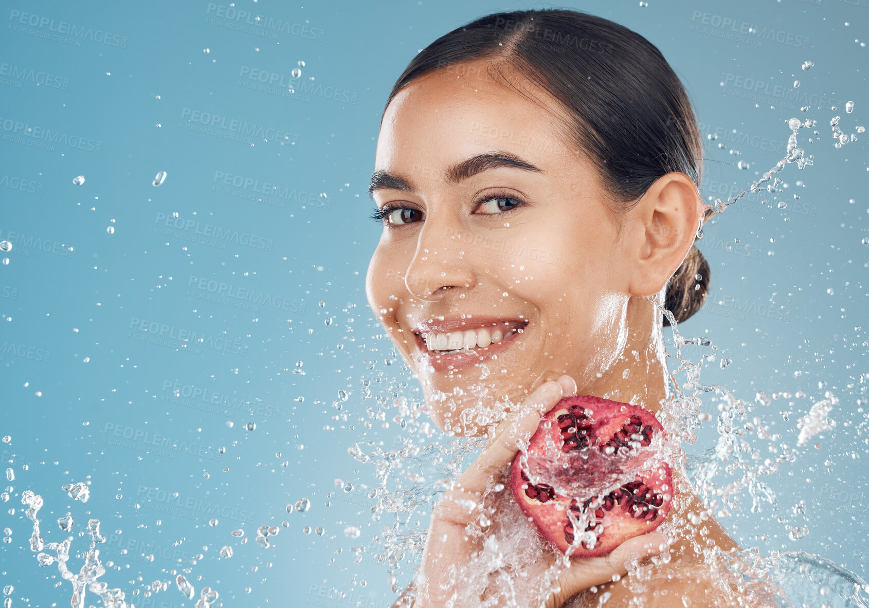 Buy stock photo Skincare, pomegranate and healthy woman with organic skin care for fresh face on a studio background. Fruit, food and vitamin c for glowing, smooth skin for natural beauty and cosmetic treatment 