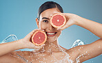 Skincare, health and grapefruit with woman in studio portrait mock up for clean face advertising or marketing. Skin wellness, detox and vitamin c fruits for vegan beauty facial product on blue mockup