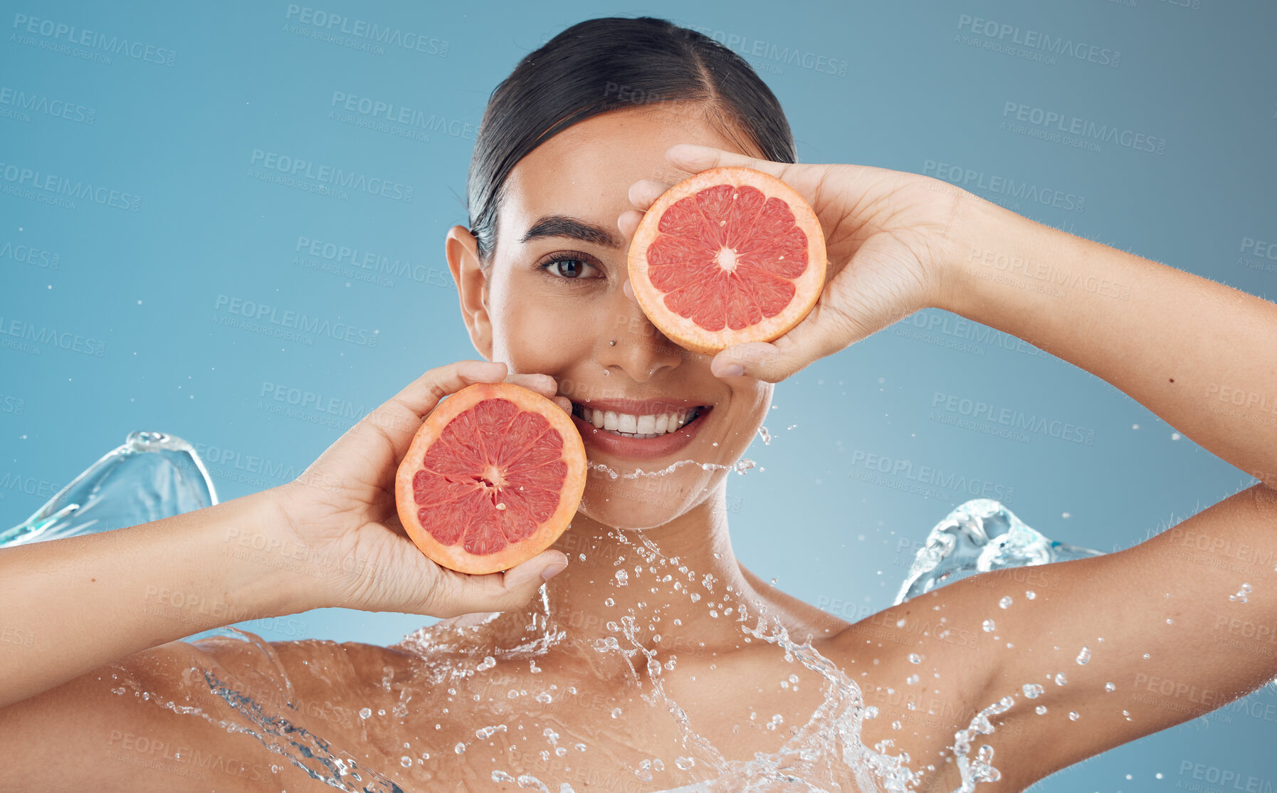 Buy stock photo Skincare, health and grapefruit with woman in studio portrait mock up for clean face advertising or marketing. Skin wellness, detox and vitamin c fruits for vegan beauty facial product on blue mockup