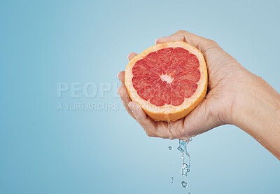 Buy stock photo Grapefruit, food and wellness fruit juice of a woman hand with a healthy lifestyle. Model hands with fresh and organic produce for skincare, body and skin health with beauty and cosmetic treatment