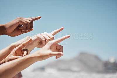Buy stock photo Group hands, fingers and pointing to sky mockup, direction and advertising space of global community outdoors. Closeup diversity people showing body language sign to blue sky, hope and ideas 