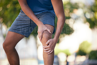 Buy stock photo Knee pain, hands and man with injury during exercise, training and running in a park, pain and inflammation. Hand, fitness and arthritis in leg of runner during workout, sport and practice outdoors
