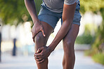 Knee pain, arthritis and legs of man runner during training, running or cardio workout in park. Muscle, leg and sport injury by athletic guy on morning run, pain and inflammation, fracture and hurt