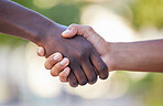 Teamwork, fitness and handshake by hands in support of training, exercise and healthy lifestyle against bokeh background. Wellness, sports and friends shaking hands before a competitive game outdoors