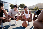 Basketball, team and meeting in game discussion for strategy, planning or collaboration on the court. Group of sports men talking in teamwork, conversation or match plan together in the outdoors