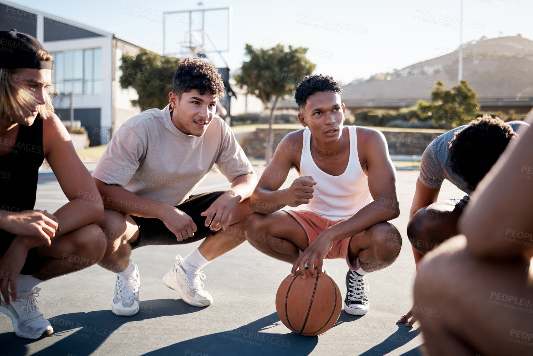 Buy stock photo Basketball, team and meeting in game discussion for strategy, planning or collaboration on the court. Group of sports men talking in teamwork, conversation or match plan together in the outdoors