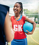 Black woman, netball player and handshake on court in fitness game, workout match or training competition exercise. Smile, happy and sports women in welcome, thank you or good luck gesture in stadium