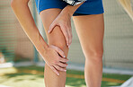 Netball hands, sports muscle and woman injury with medical emergency during sport game on court. Professional athlete with pain after knee accident or training for competition, event or fitness match