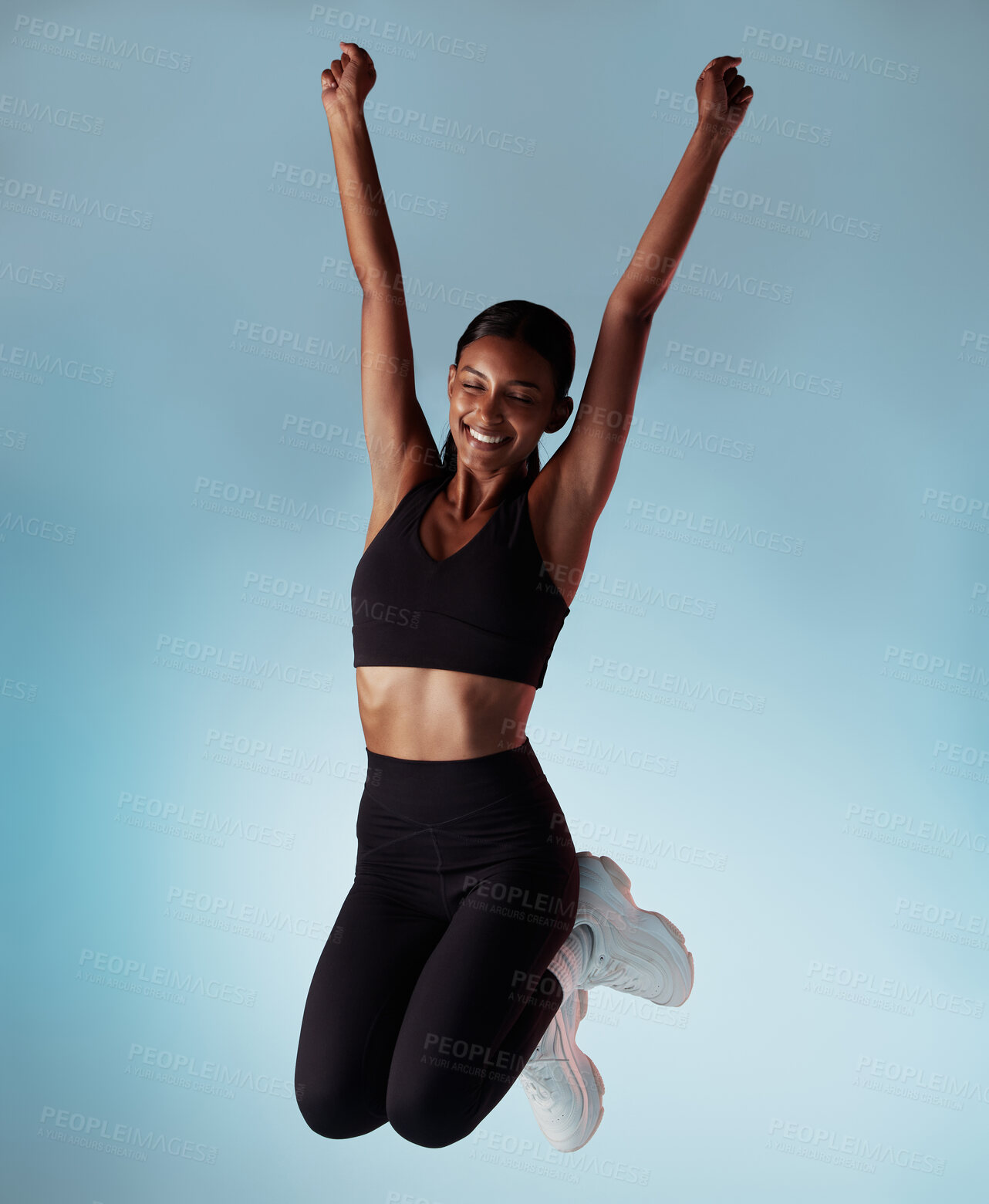 Buy stock photo Celebration, success and woman excited about fitness, gym and health against blue mockup studio background. Happy, smile and girl athlete with wellness, energy and motivation for exercise and workout