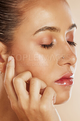 Buy stock photo Face, beauty and skincare of woman with eyes closed isolated on brown studio background. Wellness, aesthetic makeup or cosmetics and model from Australia with glowing, healthy and perfect skin.

