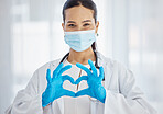 Heart, covid and hands of a doctor with support, love and help in healthcare at hospital. Medicine, insurance and portrait of a nurse with a face mask for virus, care at a clinic and helping at work