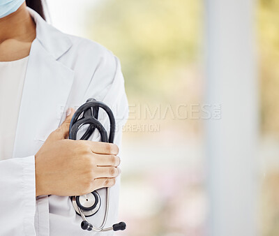 Healthcare, Covid and doctor, woman with stethoscope in hand and boss at hospital or clinic cropped. Help, success and support, confident female medical professional or health care employee at work.