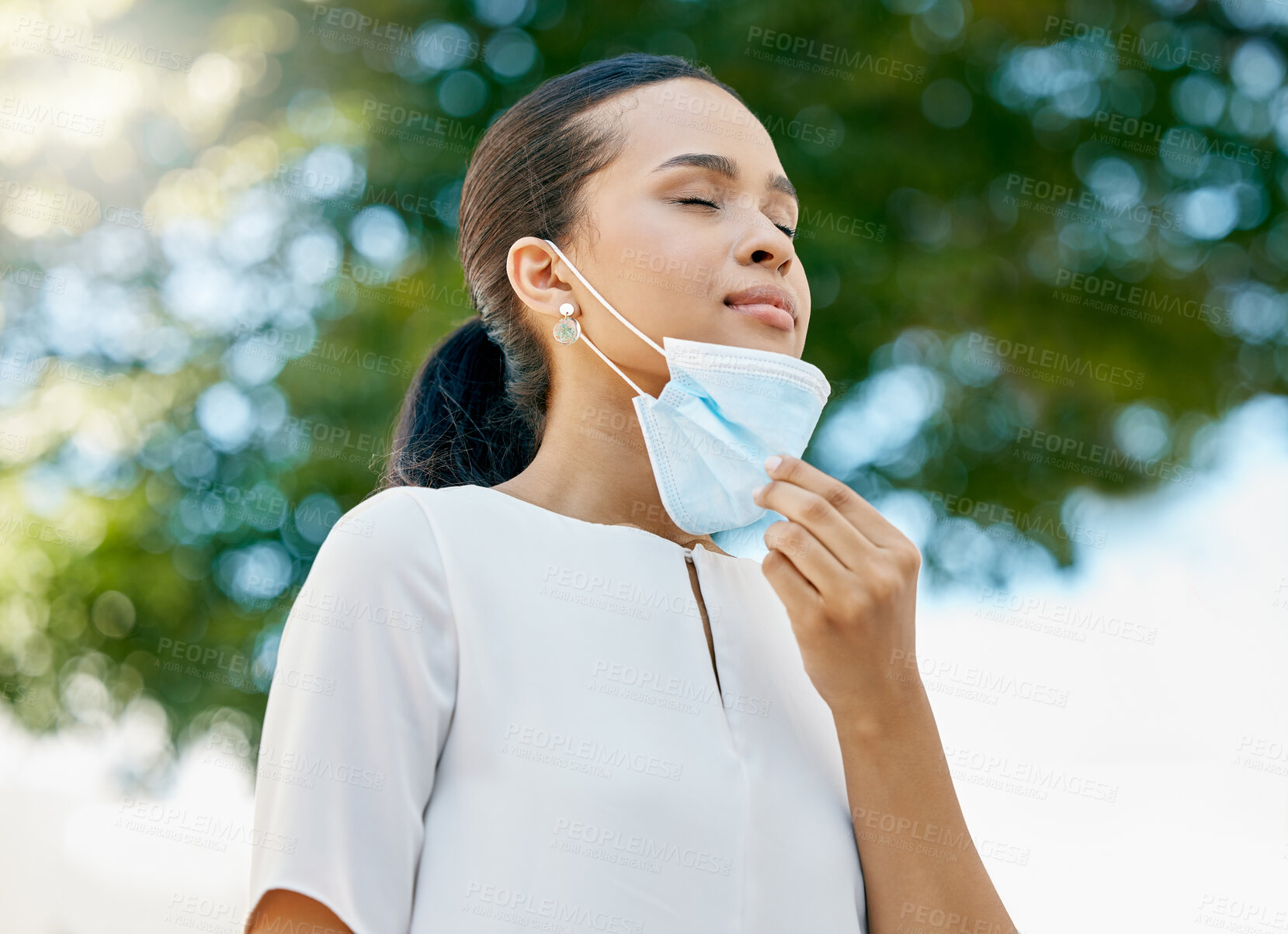 Buy stock photo Covid, take off mask and woman breathing, being calm and peaceful outdoor for break. Healthy female relax, breath and remove face cover for end of corona, pandemic and enjoy fresh air outside freedom