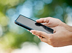 Mockup, phone and closeup of hands in nature with blank, empty and black screen. Technology, internet and person holding smartphone in outdoor park for social media, fitness tracking and mobile app