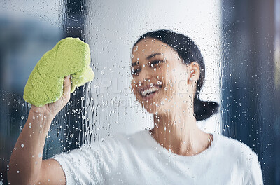 Buy stock photo Cleaning, washing window and woman with cloth in hand to wipe water, detergent and cleaning products. Hygiene, housekeeping and happy girl doing housework, chores and  and wash or clean clear glass