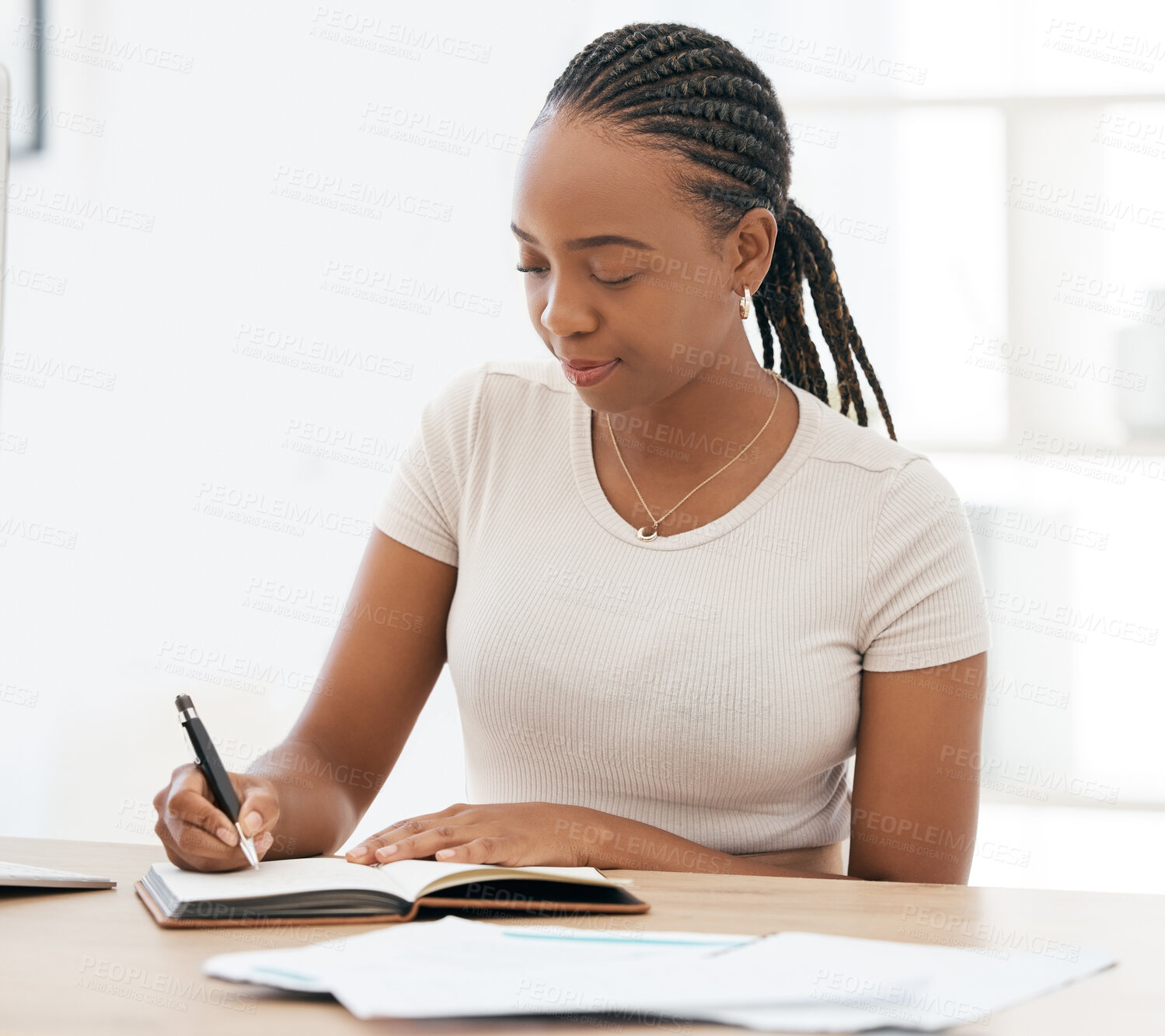 Buy stock photo Notebook, working and black woman writing notes in office, sitting at desk. Ideas, vision and businesswoman with pen in hand to write, jot and taking notes in business meeting in book or work diary
