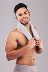Studio portrait smile, man towel fitness against grey wall for cosmetics beauty and healthy skin. Skincare health model, happy cosmetic face and bathroom cloth to relax with happiness  background