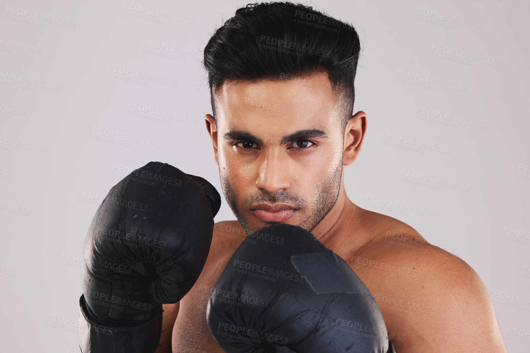 Buy stock photo Sports, boxing and portrait of man with boxing gloves isolated on white background studio. Fitness, exercise and Indian man training with determination, focus and motivation for winning match or game