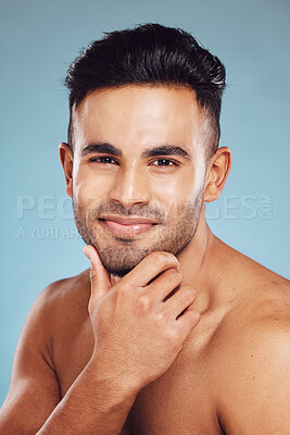 Buy stock photo Skincare, beauty and a portrait of man, topless touching beard with healthy skin and natural facial glow and smile on face in India. Male body care, health and model in studio with blue background.