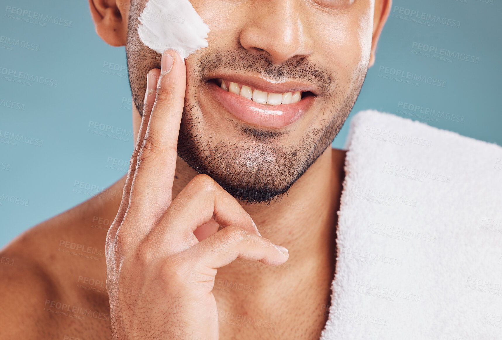 Buy stock photo Man with shaving cream on face, skincare with luxury beauty product or clean facial hair on blue studio background. Apply sunscreen lotion to body, male dermatology or natural beard with happy smile