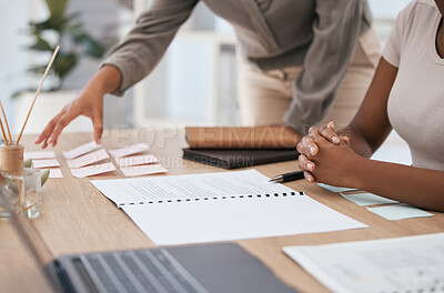 Buy stock photo Hands, meeting and planning with documents, sticky notes and equipment on a desk in an office with a business team at work. Paper, teamwork and strategy with female colleagues working together