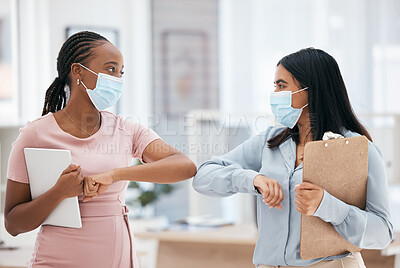 Buy stock photo Covid, greeting and teamwork with a business woman and colleague in business working together in their office. Collaboration, diversity and mask with an employee team during the corona virus pandemic