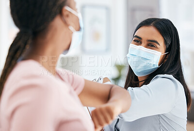 Buy stock photo Covid, elbow bump and employees greeting while wearing face mask in office for teamwork and collaboration. Business women social distancing during covid 19 in a clean, diversity and coworking office