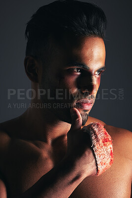 Buy stock photo Face, fighting and blood with a man in studio on a gray background ready for a competitive fight. Sports, MMA and boxing with the hand of a young male in a bandage during a brawl or altercation