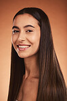 Beauty, skincare and face portrait of woman on brown studio background. Makeup, facial cosmetics and female model from Canada with healthy, glowing and perfect skin care routine and beautiful smile.