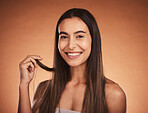 Beauty portrait, skincare and hair care of woman isolated on brown studio background. Wellness, makeup and smile of happy female model from Australia with healthy, long and beautiful silky hair.

