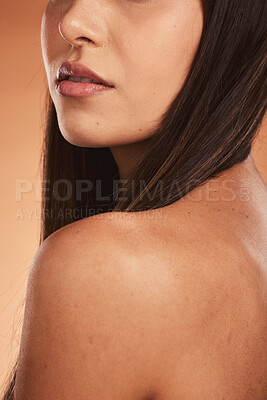 Buy stock photo Beauty, skin and woman shoulder, hair and back in studio for skincare, wellness and grooming on orange background. Face, skin and girl model relax with pamper, haircare and bronze aesthetic mockup