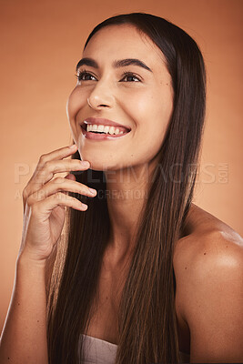 Buy stock photo Beauty, skincare and thinking with a model woman in studio on a beige background with a wellness idea. Face, cosmetics and luxury with a female posing to promote a natural skin product or treatment