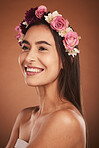 Beauty, skincare and portrait of woman with flower crown, smile on face and fresh clean glowing skin. Happy girl model, from Mexico with pink rose band in hair and and fashion with studio background.