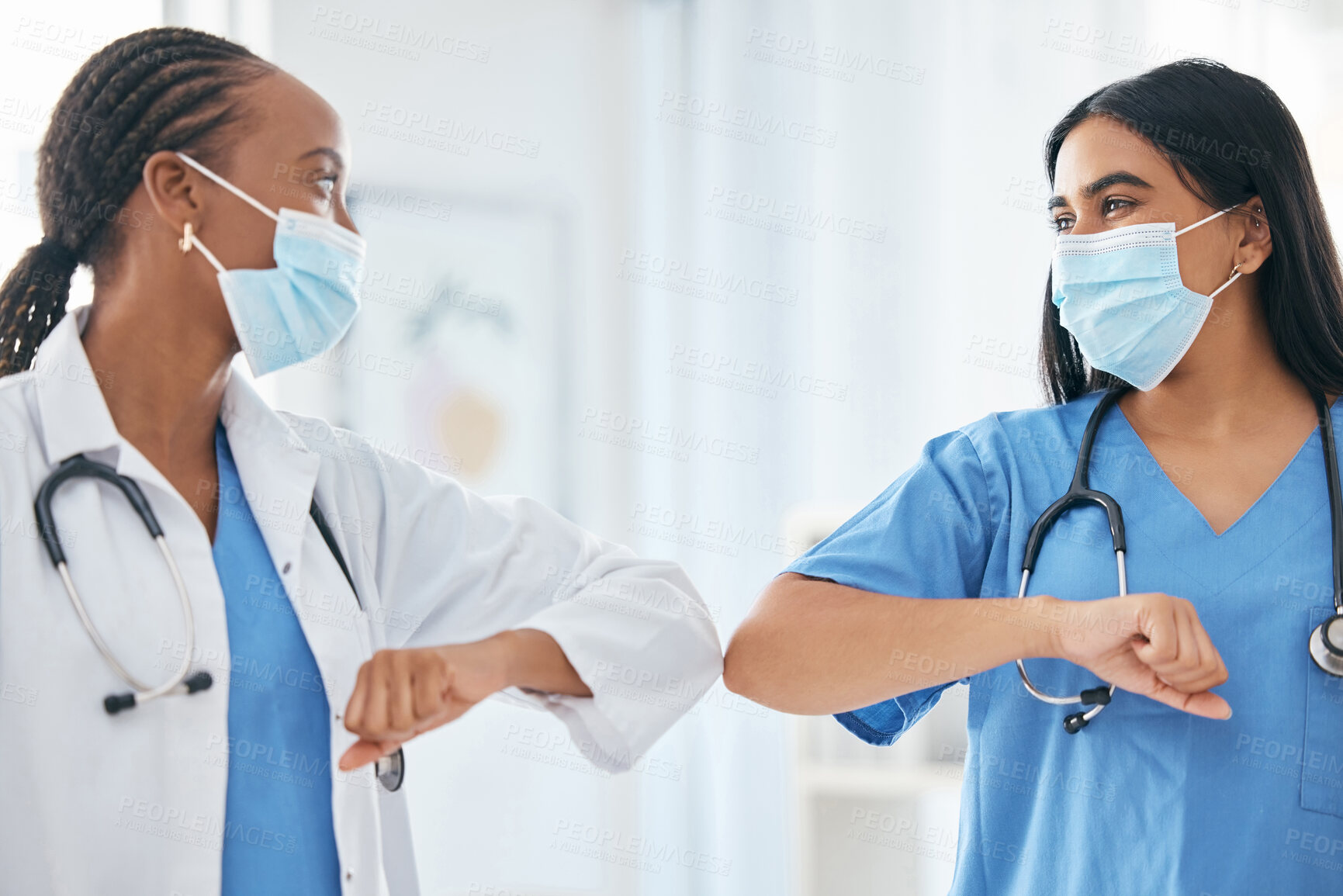 Buy stock photo Healthcare, covid and women doctor greeting with elbow, compliance and social distance in hospital. Safety, corona and medical team greet by covid 19 rules before working, help and planning together