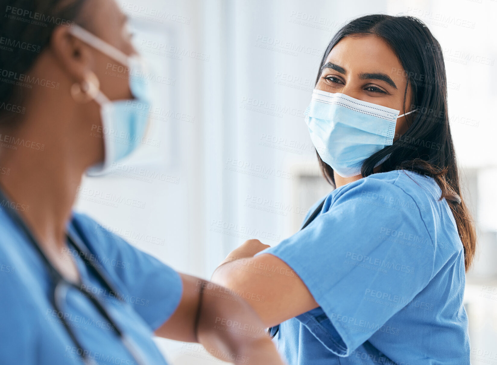 Buy stock photo Covid, women and doctors elbow greeting in surgical mask at hospital or clinic during the pandemic. Teamwork, healthcare worker and medical professional with protection from virus for doctor or nurse